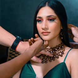 A fashionable woman being prepared for a photoshoot, adorned with elegant jewelry and makeup. — Neatcell Pen Reviews: Explori